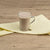 A  Glass Of Wholesome Ragi Sattu Drink  is on a Yellow Cloth .