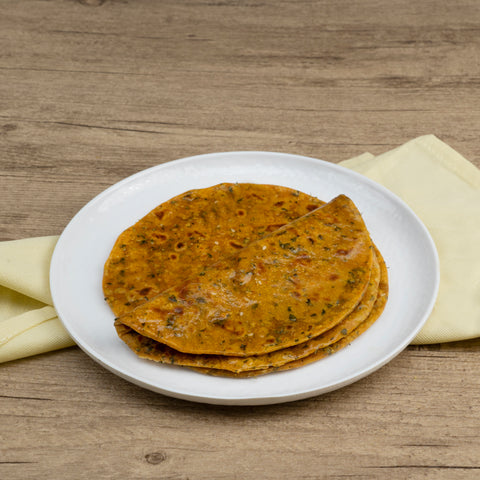 Methi paratha  on a white plate